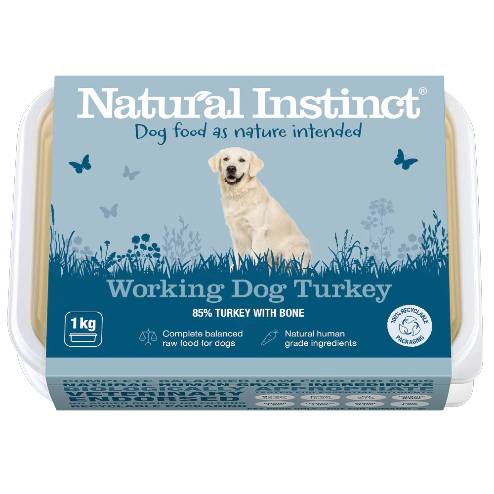 Natural Instinct Working Dog Turkey raw dog food with 85% turkey and bone, vitamin C, and natural ingredients in recyclable packaging.