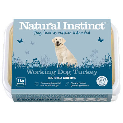 Natural Instinct Working Dog Turkey raw dog food with 85% turkey and bone, vitamin C, and natural ingredients in recyclable packaging.